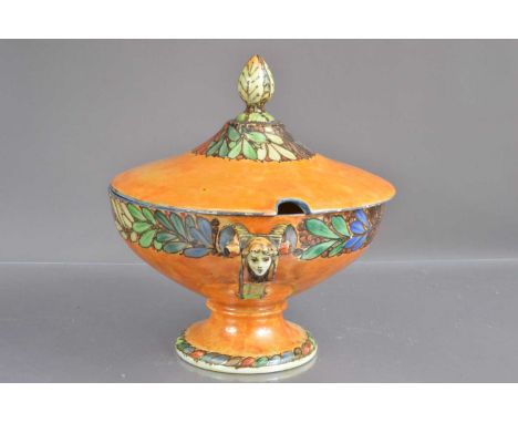 A large Art Deco style lustre-glaze tureen bowl and cover the looped handles with faces, flower decoration to outside and bud