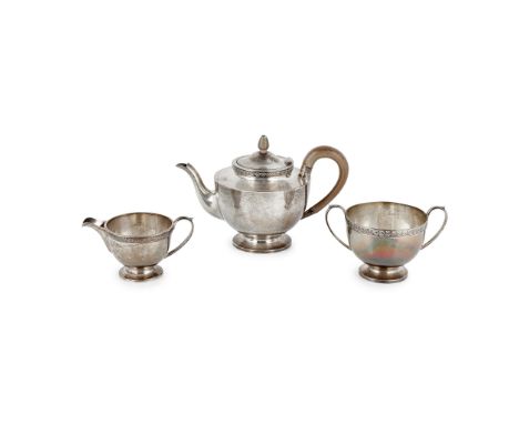 Hawksworth, Eyre &amp; Co Ltd, Sheffield 1918/19, comprising teapot, twin handled sugar basin and milk jug, all of circular f