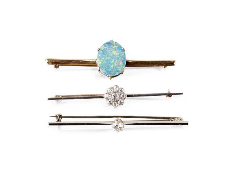 to include a single stone old round-cut diamond set bar brooch, unmarked; a diamond set floral cluster bar brooch, unmarked; 