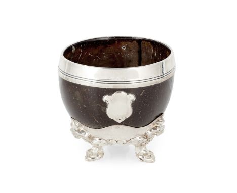 Sheffield 1852, the plain polished shell with applied reeded rim, blank cartouche and three scrolling fleur-de-lis bracket fe