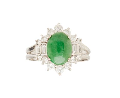 claw set with an oval jade cabochon, in a border of round brilliant and baguette cut diamonds, to a plain shank, stamped 750(