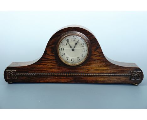 A 1920s mahogany "Napoleon's hat" mantle clock, 37 cm x 16 cm