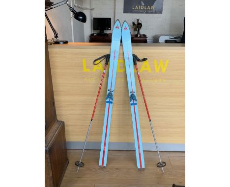 Vintage ski poles, together with Tyrolia Junior Clix release step-in heel binding and Hagan Sprint Junior skis