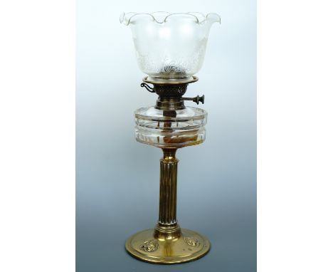A Victorian cut glass and brass oil lamp together with an Art Nouveau etched glass shade, 49 cm