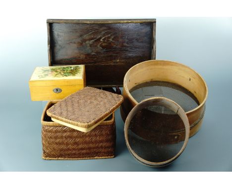 A vintage wooden tea tray, sieves, a Mauchline ware sewing / trinket box and a rattan box