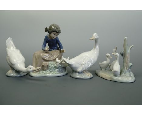 Four Nao figurines including a girl with doves 