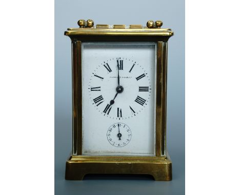 A Mappin and Webb brass carriage clock, 15 cm high