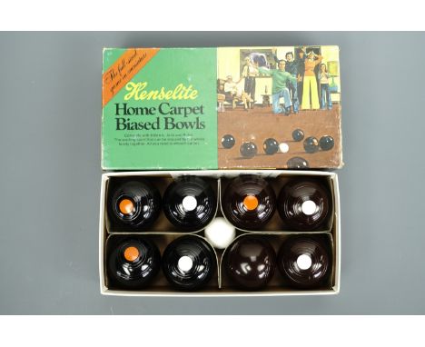 A boxed set of Henselite carpet bowls, (as new)