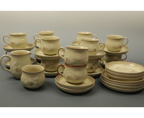 A large quantity of Denby dinner and teaware, comprising approximately seventy five items, (one cup rim chip and one sugar ba