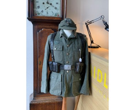 A replica Second World War German army tunic, cap and kit