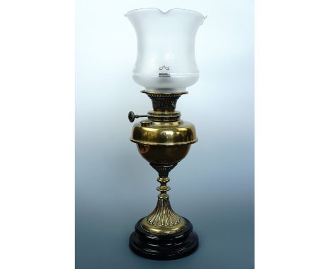 A Victorian brass  and black ceramic oil lamp with later etched shade (converted)