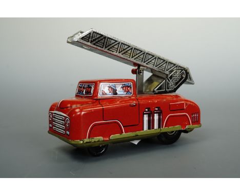 A West German tin plate fire engine, 10 cm long 