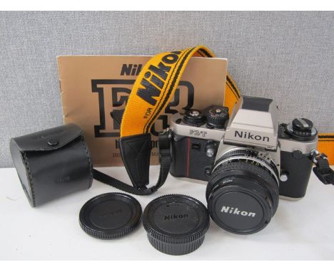 A Nikon F3/T Titanium SLR camera with 50mm lens and manual