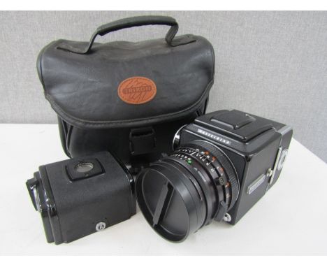 A Hasselblad 500C/M medium format camera with Planar 2.8/80mm Carl Zeiss lens, serial 6655488, cased