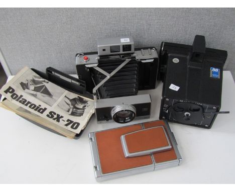 Three Polaroid cameras including Land 190