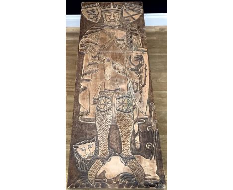 A coffee table, the top hand carved with a medieval style full-length portrait of Robert I or Robert the Bruce, hand carved b