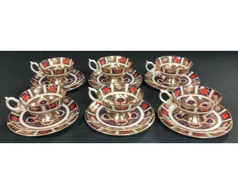 A set of six Royal Crown Derby Imari 1128 pattern teacups, saucers and tea plates, first quality, printed marks in red 