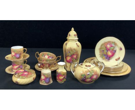 An Aynsley Orchard Gold pattern hexagonal ginger jar and cover; sucrier and cover; two teacups and one saucer; pair of coffee