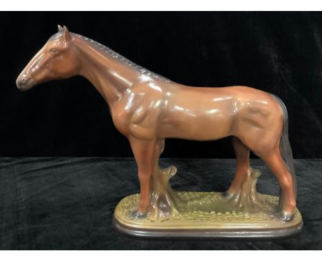 A Staffordshire model of a bay horse, 37cm high, 48cm wide 