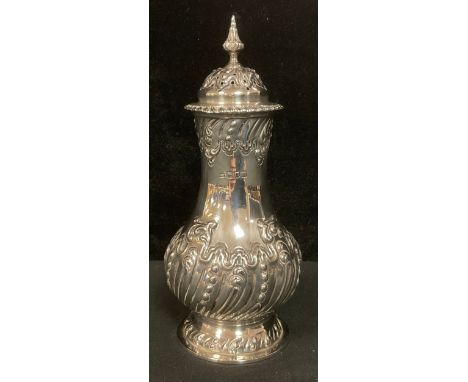 An Edward VII silver baluster sugar caster, pierced domed gadrooned cover with spire finial, spirally stop fluted with spread