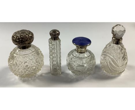 An Edwardian silver mounted globular cut glass scent bottle, hobnail cut, drop-in stopper, 10cm, London 1904; a George V glob