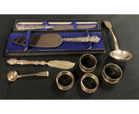 A Victorian silver sauce ladle, London 1861, 69g; a Victorian silver butter knife, Sheffield 1847, hollow filled; a George II