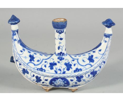 A TURKISH IZNIK GLAZED POTTERY WATER FLASK painted with foliate decoration, 22cm wide