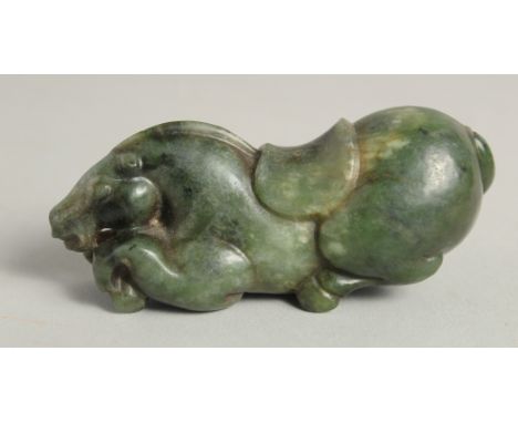 A CHINESE CARVED JADE FIGURE OF A HORSE, 9cm long.