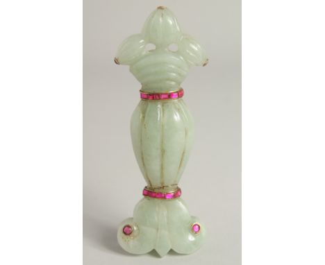 A MUGHAL STYLE CARVED JADE DAGGER HANDLE, onlaid with semi-precious stones, 13.5cm long.