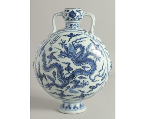 A CHINESE BLUE AND WHITE PORCELAIN TWIN HANDLE MOON FLASK, painted to each side with a dragon and the flaming pearl of wisdom