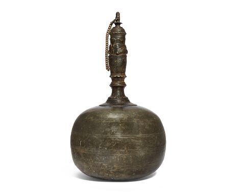 A brass surahi flask with makara headed spout, South India, late 18th century, of bulbous form, the neck rising in sections t