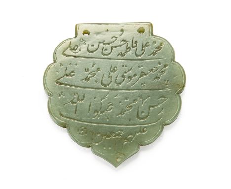 A jade lobed calligraphic pendant (haldili), India, 17th-18th century, inscribed with four lines of nasta'liq Persian calligr