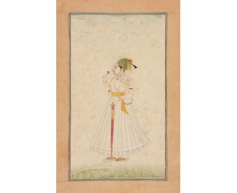 Zorawar Singh of Bikaner, Bikaner, India, circa 1730, gouache on paper heightened with gilt, shown standing wearing white rob