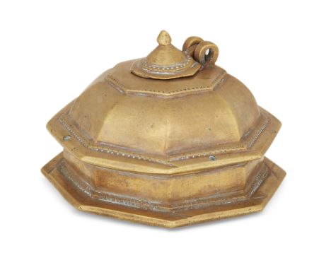 A brass inkwell, North India, 19th century, of octagonal shape, with hinged domed lid, 7 cm. high, 9.5 cm. diameterProvenance