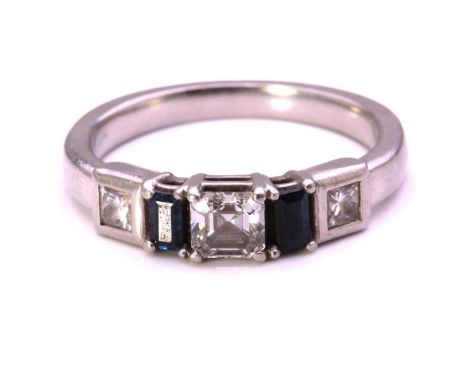 A diamond and sapphire dress ring in platinum, featuring an Asscher-cut diamond of 0.42ct in the centre, flanked by two bague