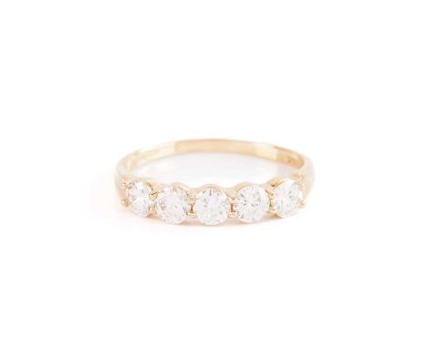 A five stone diamond half hoop ring; the five round briilant cut diamonds in claw mounts to a plain 18 carat gold shank. Size