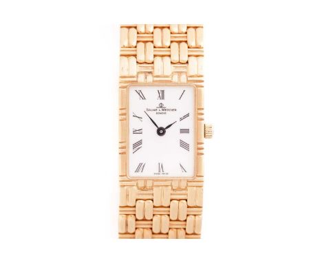 Baume and Mercier. A lady's 18 carat gold wristwatch; the rectangular white enamel dial with Roman numerals; within an integr