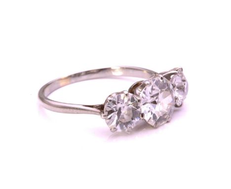 A diamond trilogy ring, comprising three graduated Old-European cut diamonds with an estimated total diamond weight of 2.85ct