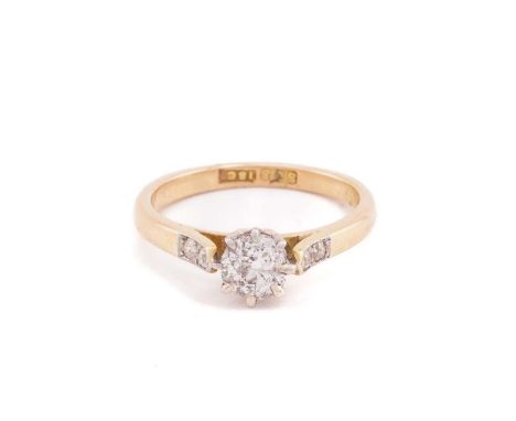 A single stone diamond ring; the old brilliant cut diamond in eight claw mount above two stone diamond shoulders and plain sh