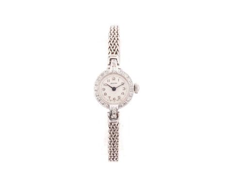 A lady's 9 carat white gold and diamond cocktail watch by Vertex; the silvered dial with Arabic numerals and outer minute tr