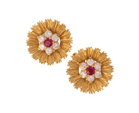 A pair of 18 carat gold, ruby and diamond cluster earrings; the seven stone cluster set with a central circular cut ruby and 