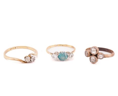 A four stone rose cut diamond cluster ring; a diamond two stone crossover ring and three stone half hoop diamond and zircon r