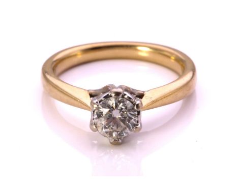 A diamond solitaire ring in 18ct gold, comprising a circular-cut diamond of 5.2 x 5.2 x 3.1 mm, in an illusion setting with t