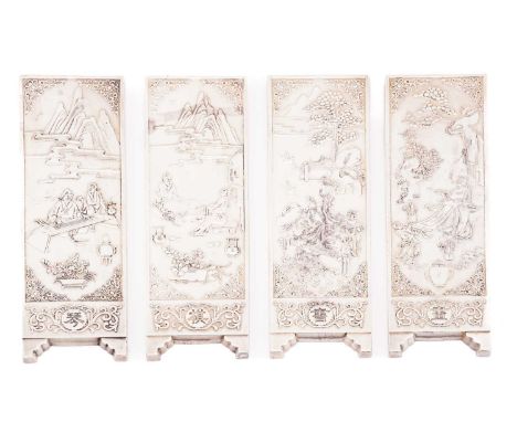 Four modern Chinese decorative paperweights of screen form, the panels depict the 'four arts of a Chinese scholar' - the mast