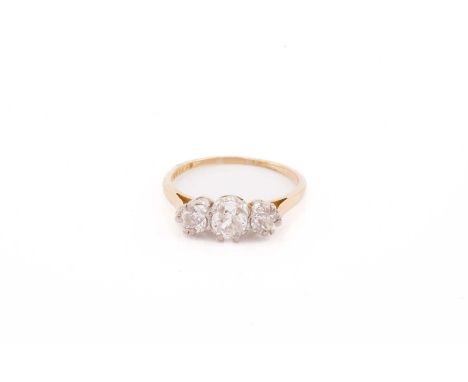 A three-stone diamond half-hoop ring, comprising three graduated old-cut diamonds in claw setting, to tapering D-section shan