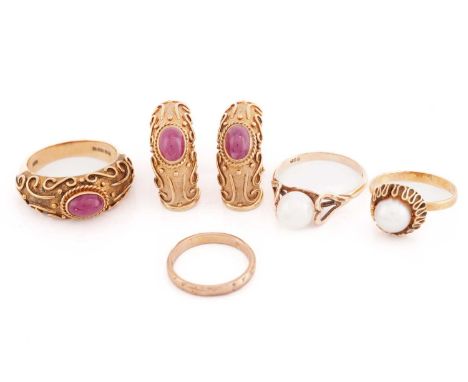 A pair of ruby set earrings with matching ring, together with a further three rings; the 9ct gold earrings each comprising an