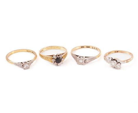 A ring in 22ct gold together with three other gem-set gold rings; a solitaire ring set with a CZ replacement stone, with diam