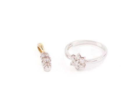 An 18ct white gold and diamond set daisy cluster ring, the seven round brilliant-cut diamonds of approximately 0.30 carats co