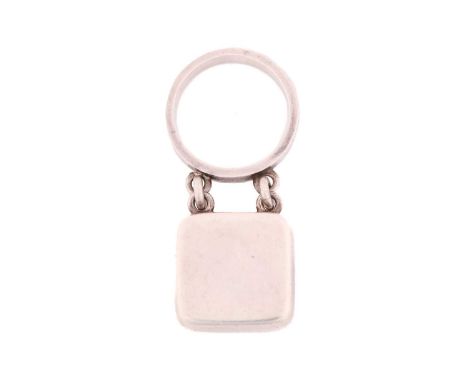 Georg Jensen - square dangle ring, with a hollow rounded square charm attached to a flat ring band, designed by Astrid Fog, N