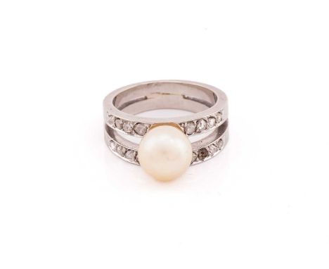 A pearl and diamond dress ring, centred with a cream-coloured pearl of 8.5 mm, bifurcated shoulders set with rose-cut diamond